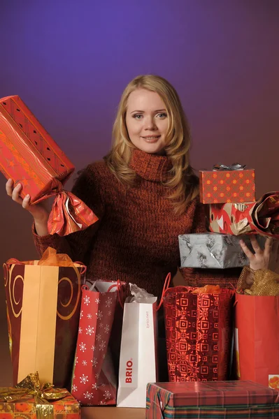 Young woman with a lot of present box — Stock Photo, Image