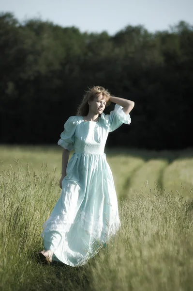 stock image Young woman in an retro dress in the field