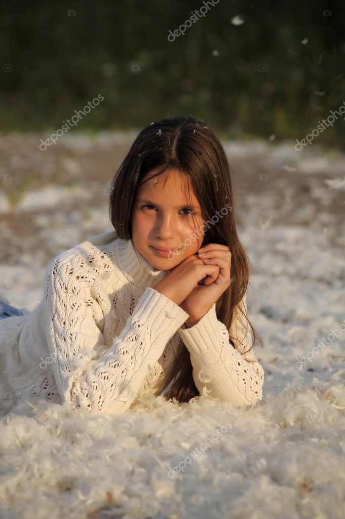 Young Beautiful Girl Filled Up By Small Feathers Stock Photo