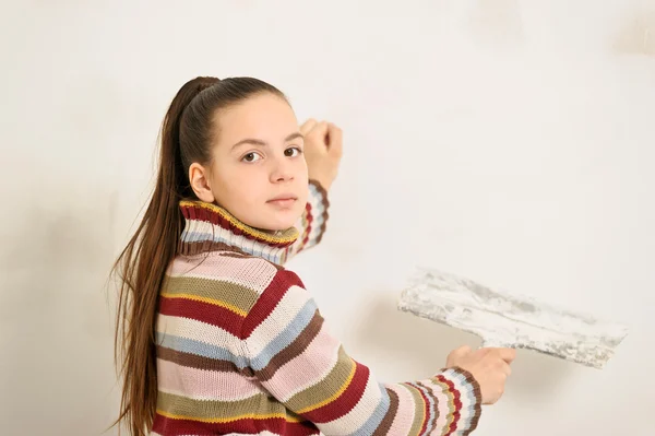 Girl plastering — Stock Photo, Image