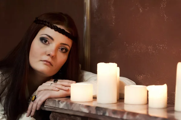 Girl at night with candles — Stock Photo, Image