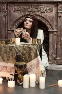 Fortune-teller with tarot cards clipart