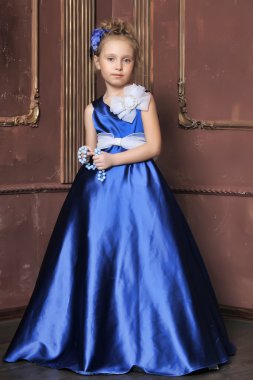 Little girl in a smart blue dress clipart