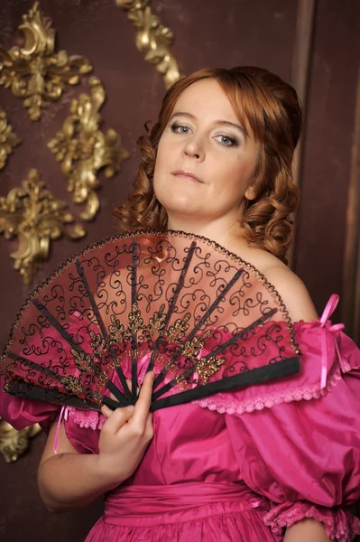 Woman with fan in medieval dress — Stock Photo, Image