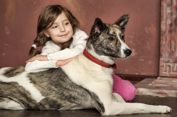 Portrait of a little girl with dog — Stock Photo, Image