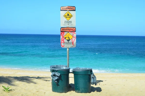 stock image Beach hazard signs and dustbins