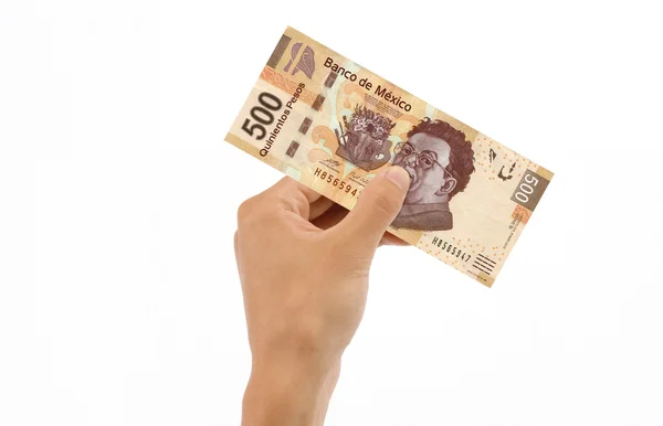 Hand met 500 pesos bill — Stockfoto