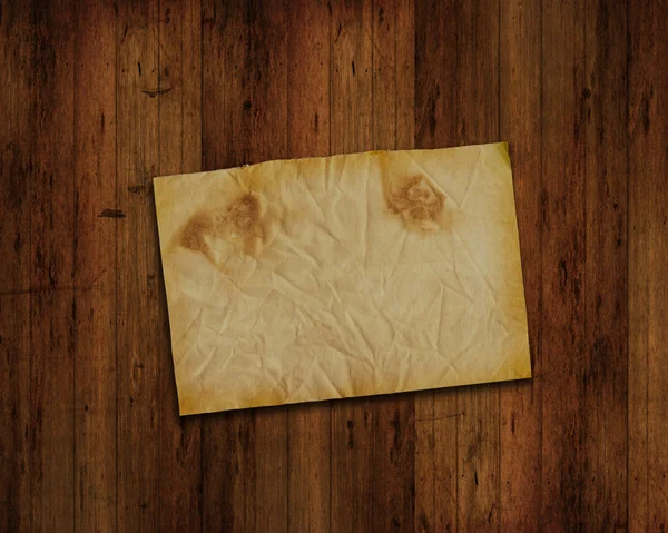 Grunge ahşap zemin üzerinde eski kağıt — Stok fotoğraf