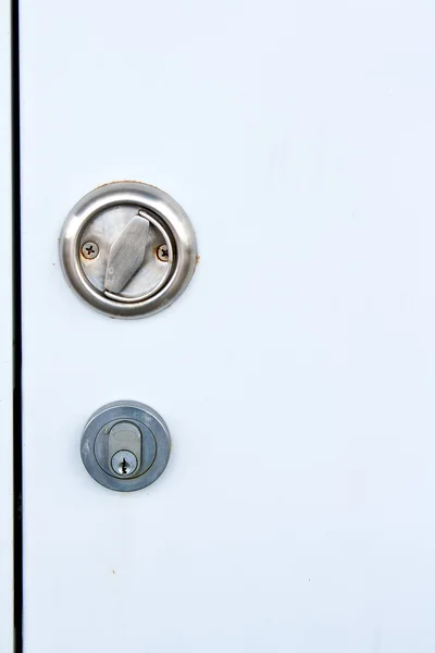 White steel door with hide handle and key lock — Stock Photo, Image