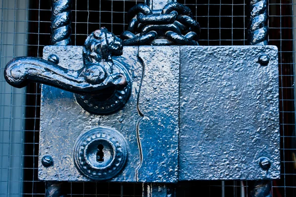 Classic black steel door handle with lock — Stock Photo, Image