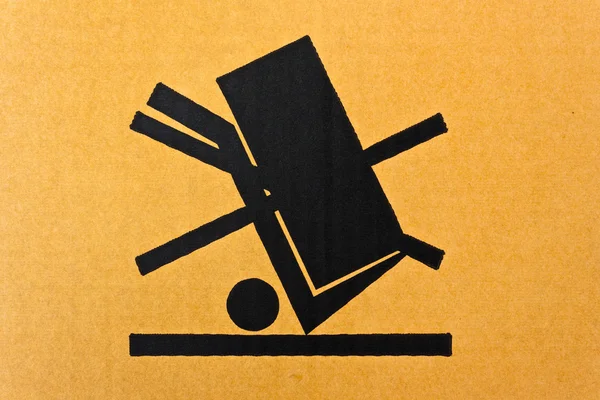Image close-up of grunge black fragile symbol on cardboard — Stock Photo, Image