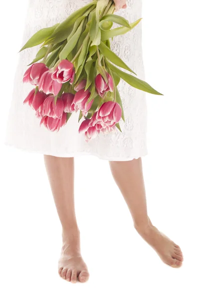 Nogi kobieta i kwiaty — Zdjęcie stockowe