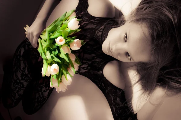 Girl with bouquet of tulips — Stock Photo, Image