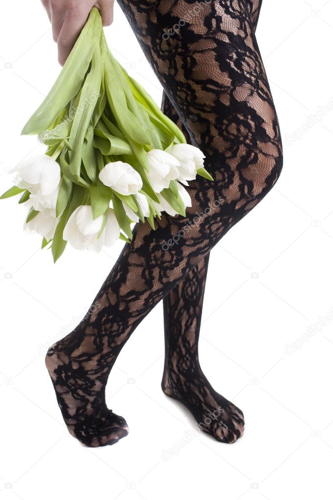 Woman legs and flowers