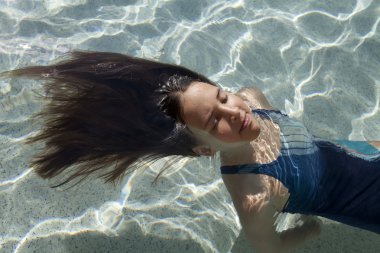 School girl in the swimming pool clipart