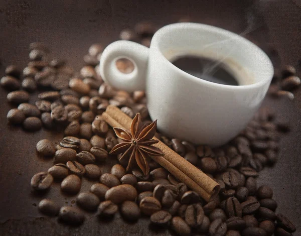 Cup of hot coffee with chinnamon, anise — Stock Photo, Image