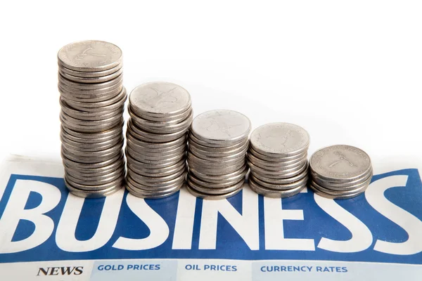 Coins diagram on the business newspaper — Stock Photo, Image