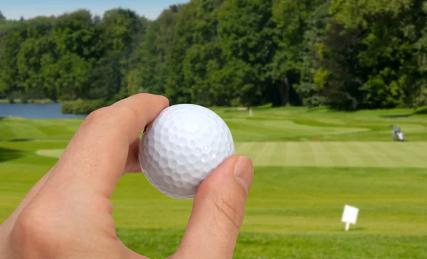 Mano con pelota de golf — Foto de Stock