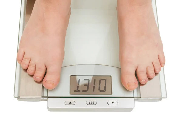 stock image Female feet on scales