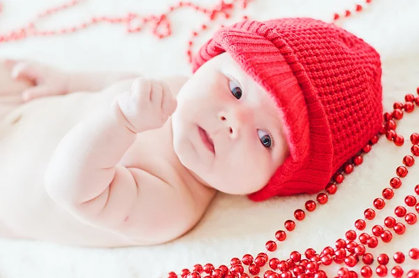 Cute baby in red winter hat — Stock Photo, Image