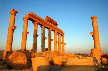 Relics of Palmyra in Syria at sunset clipart