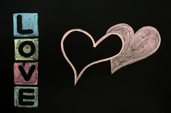 Miłość rysowane kredą na tablicy szkolnej — Zdjęcie stockowe
