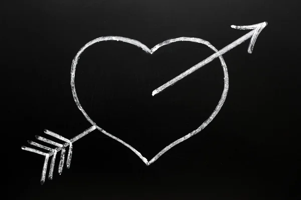 Heart with Cupid's arrow hitting through — Stock Photo, Image