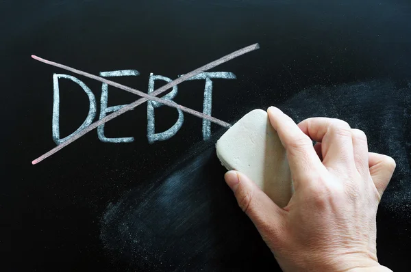 Debt being crossed out and wiped off — Stock Photo, Image