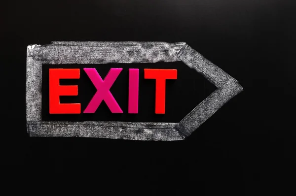 Exit - ordet gjord av färgglada bokstäver — Stockfoto