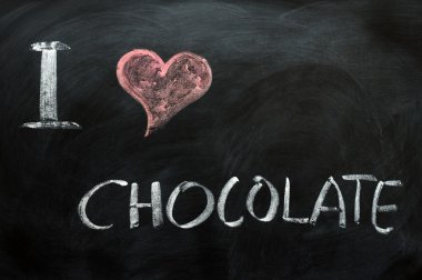 I love chocolate - text written on a blackboard clipart