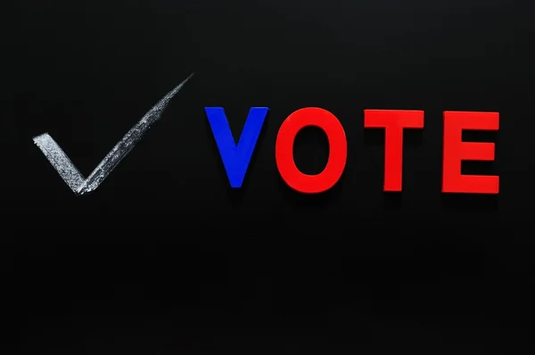 Vote made of colorful lettes on a blackboard — Stock Photo, Image