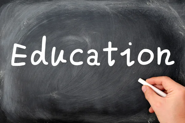 Education written on a blackboard background — Stock Photo, Image