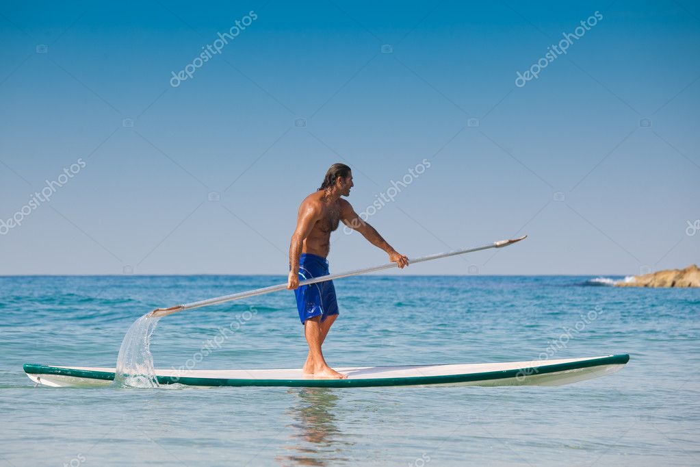 surfboard with oar