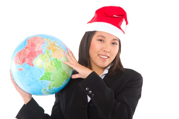 Asian businesswoman with santa hat and globe — Stock Photo, Image