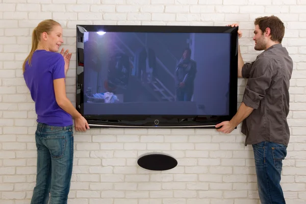 stock image Couple hanging television