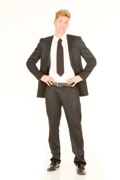 Businessman with hands on hips — Stock Photo, Image