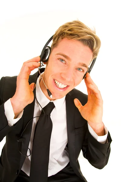 Biznesmen z słuchawki i mikrofon opearto obsługi klienta — Zdjęcie stockowe