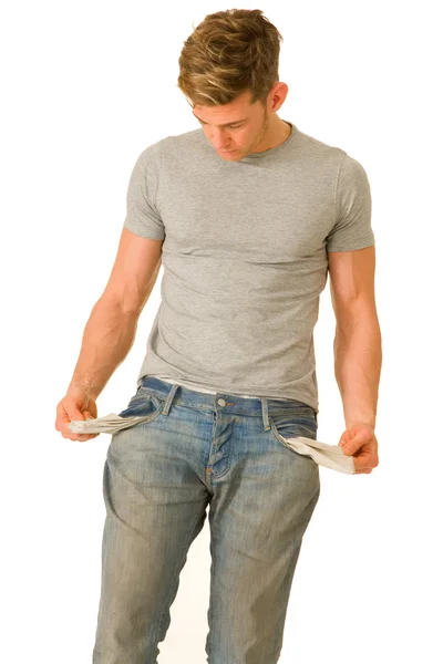Young man with empty pockets — Stock Photo, Image