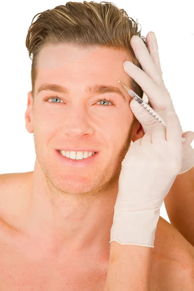 Botox enjeksiyonları yapan genç erkek — Stok fotoğraf