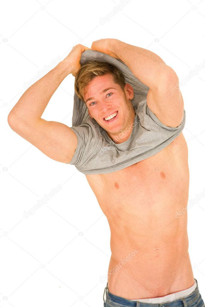 Young man takeing off the t-shirt