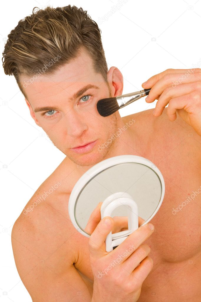 Young man getting makeup
