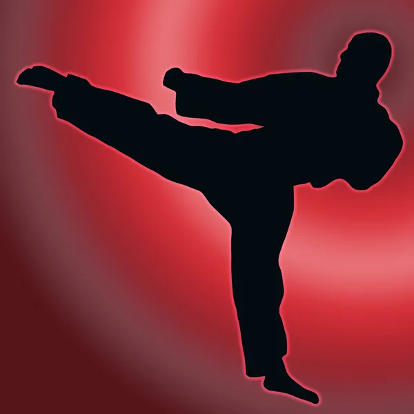 Silueta de espalda roja del deporte - patada de karate —  Fotos de Stock