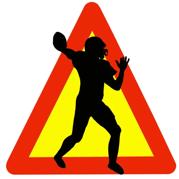 Futebol jogador silhueta no sinal de aviso de tráfego — Fotografia de Stock