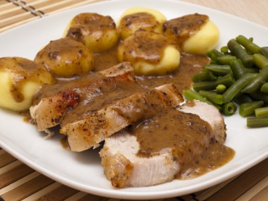 Roast pork in gravy with Silesian dumplings clipart