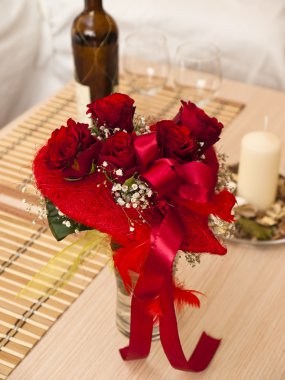 Bouquet of red roses and wine clipart