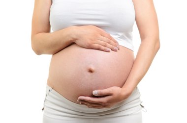 Image of pregnant woman touching her belly with hands clipart