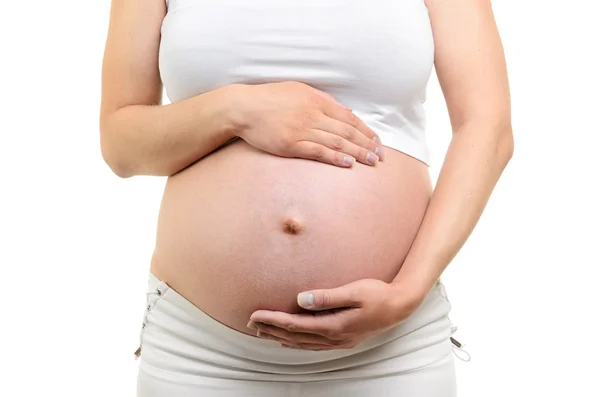 Afbeelding van zwangere vrouw aanraken van haar buik met handen — Stockfoto