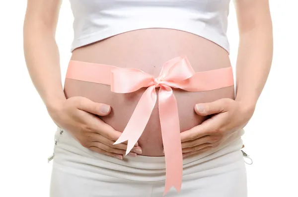 Vientre embarazada con cinta rosa —  Fotos de Stock