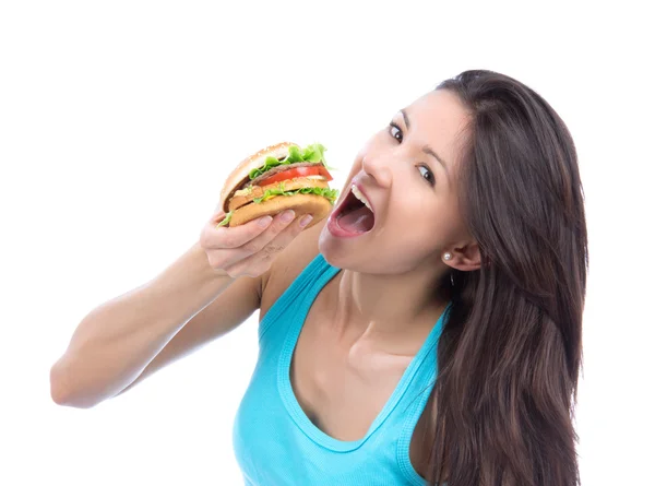 Mulher com hambúrguer insalubre na mão — Fotografia de Stock