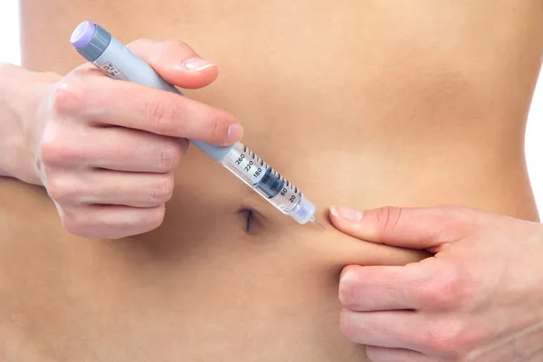 Diabetes dependent female doing human insulin shot — Stock Photo, Image